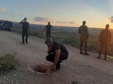 Israeli Officer examines the hole where the prisoners escaped