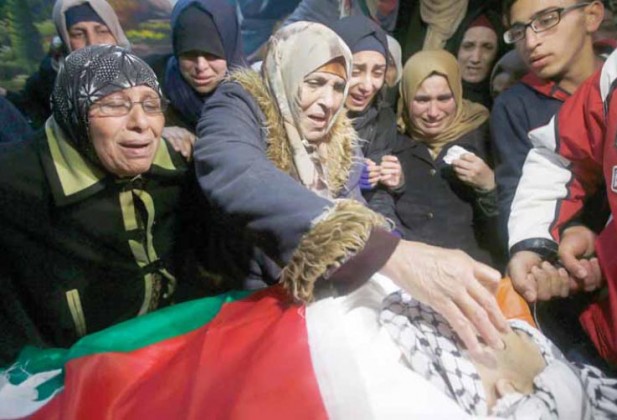 Family mourns Mohammad Salhi, killed by Israeli forces in front of his mother (PCHR photo)