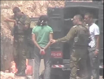 Shooting of handcuffed Palestinian (image from video by B'Tselem)