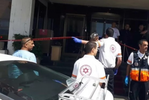 Scene outside hotel where stabbing took place (image from Ma'an)