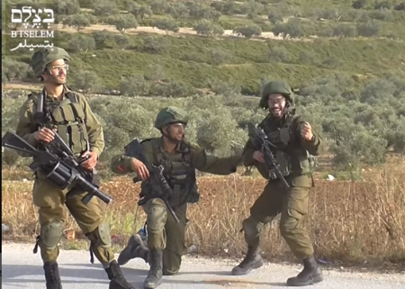 Soldiers cheer while shooting civilians (image from B'Tselem video)