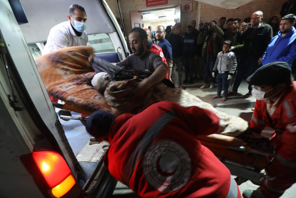 An ambulance arrives at Al-Aqsa Martyrs Hospital in Deir El-Balah with Palestinians they were able to reach who were injured in the Israeli attacks in Khan Younis on March 2, 2024