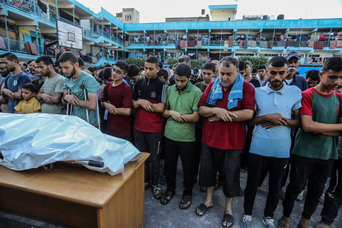 Funeral for one of the teachers killed at a United Nations School yesterday