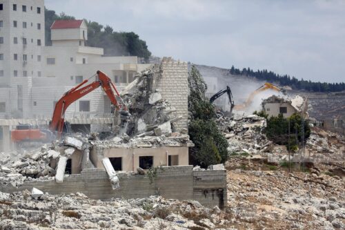 Israeli forces demolish two residential buildings in Birzeit